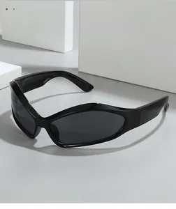 Futuristic black sports wrap sunglasses with a geometric frame on a grey surface