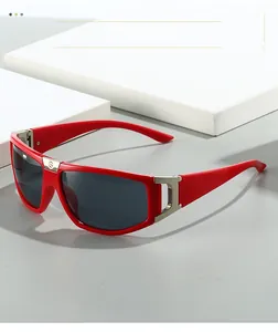 Detail of red sports sunglasses showing silver metal hinges and hollow D-shaped temple design