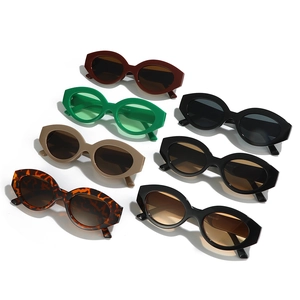 Set of seven colorful cat eye sunglasses with thick geometric frames and tinted lenses