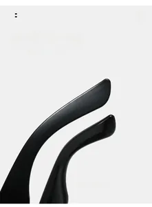 Detail of ergonomic curved temple tips on black futuristic sunglasses for comfortable wear