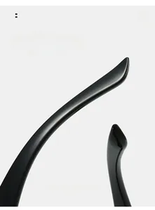 Detail of curved ergonomic temple arms on black sunglasses for comfortable outdoor wear