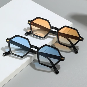 Retro polygonal sunglasses with blue and orange gradient lenses and gold accents