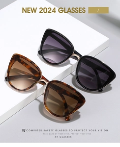Close-up of vintage cat-eye sunglasses with metal accents on white geometric steps