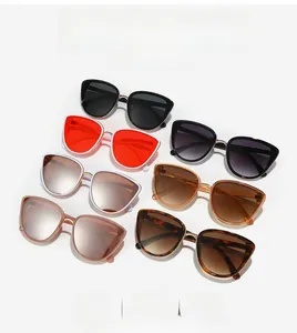 Flat lay of six classic cat-eye sunglasses with metal bridges in multiple color options
