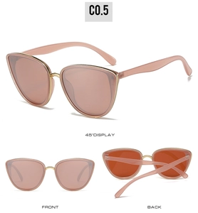 Three perspectives showing pink cat-eye sunglasses with gold metal decorative accents