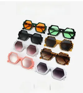 Group shot of stylish hexagonal sunglasses in various frame colors and tinted lenses
