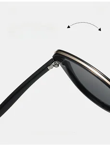 Detail view of durable metal hinges and gold trim on vintage cat-eye sunglasses