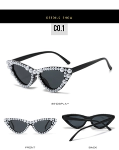 Vue détaillée des lunettes de soleil œil de chat noires ornées de perles fantaisie
