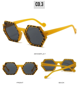 Detailed views of yellow polygon sunglasses with leopard print accents and dark lenses