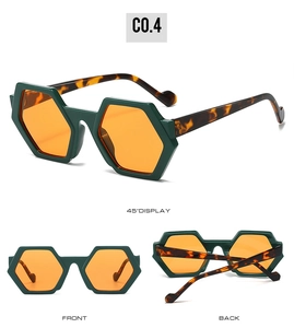 Three-angle display of hexagonal sunglasses with green frames and amber lenses