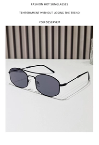 Detail of metal double bridge pilot sunglasses with silicone nose pads and dark lenses
