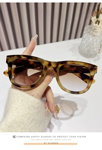 Detail of tortoise shell square glasses frame with anti-blue light clear lenses