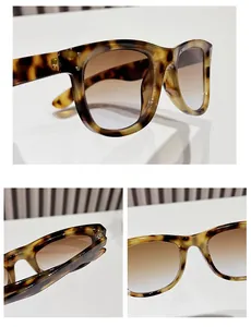 Detailed view of tortoiseshell sunglasses with gradient lenses and silver dot accents