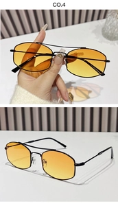 Detail of retro double-bridge sunglasses featuring irregular hexagonal orange lenses