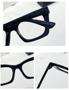 Detail view of glossy black rectangular frame with wide temples and integrated nose pads