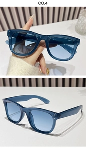 Detailed macro view of blue transparent square sunglasses with metal rivet accents