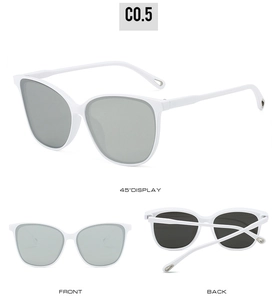 Three-angle views of oversized white cat-eye sunglasses with gray lenses and C0.5 code