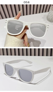 Close-up of white square sunglasses featuring silver metal rivet details and grey lenses
