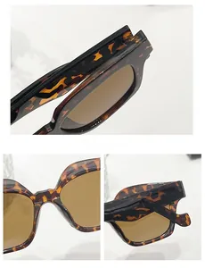 Detailed close-up of tortoise shell sunglasses frame texture and durable hinge construction