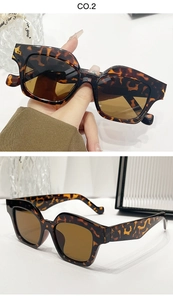 Detail view of stylish tortoiseshell square frame sunglasses with brown tinted lenses