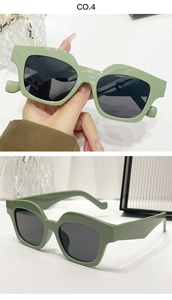 Detail view of sage green irregular thick frame sunglasses with dark grey lenses