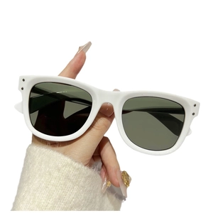 Classic white thick-frame oversized sunglasses with metal rivets and dark lenses