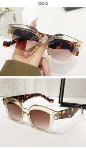Detail view of champagne frames with tortoise shell accents and brown gradient lenses
