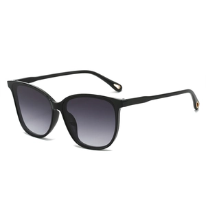 Stylish oversized cat-eye sunglasses with gradient grey lenses and gold cutout temple tips