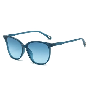Oversized cat-eye sunglasses with translucent blue frames and gradient lenses