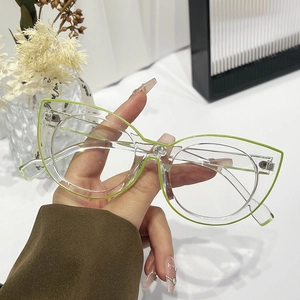 Chic cat-eye blue light blocking glasses with transparent frame and green accents