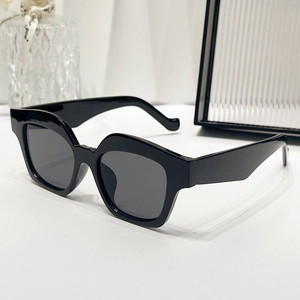 Modern minimalist black geometric thick frame sunglasses with dark lenses for women