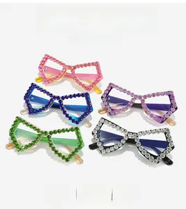Macro detail of luxury butterfly eyeglass frames with vibrant rhinestone embellishments