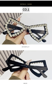 Macro view of crystal-encrusted butterfly frame with detailed 45-degree and back display