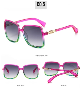 Detail of pink-green gradient oversized square sunglasses with gold metal temple accent