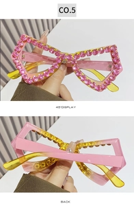 Detail of pink bow-shaped sunglasses with shimmering rhinestones and gradient temples