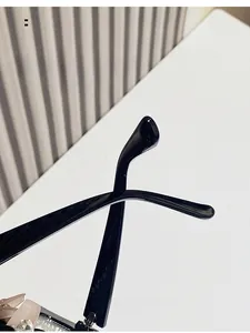Detailed view of the curved black temple tips for comfortable ergonomic eyewear fitting