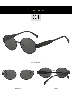 Detailed view of black oval sunglasses featuring matte frames and dark grey tinted lenses