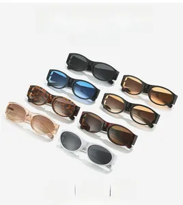 Flat lay of multiple retro oval sunglasses in various colors on a clean white background
