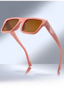 Pink oversized square sunglasses with brown polarized lenses and thick frame