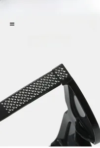 Detail of black glossy sunglasses temples with inlaid rhinestones and elastic texture