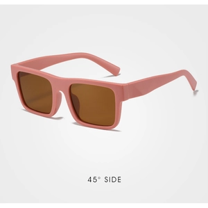 Close-up of matte pink square sunglasses with brown lenses shown at a 45-degree side angle