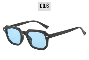 Close-up of thick black square frames with rivets and light blue transparent lenses