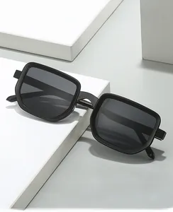 Close-up of black square frame sunglasses with wide temples on a geometric platform