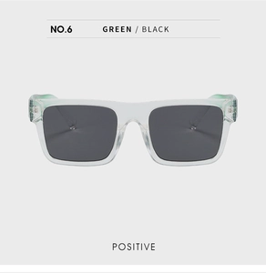 Front view of square light green transparent sunglasses with dark lenses and UV protection