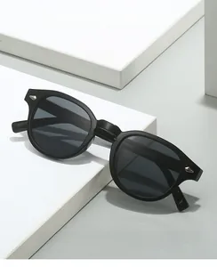 Detailed close-up of retro black round glasses frame with silver diamond metal studs