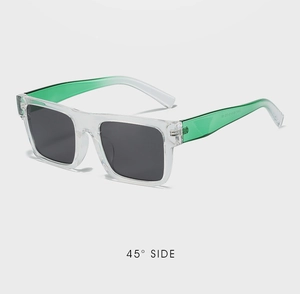 Detail of trendy square sunglasses featuring green gradient frames and 45-degree side profile