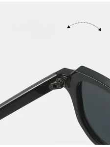 Detail of reinforced metal hinge on black square sunglasses for durability