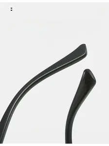 Close-up of curved glossy black temple arm detail on stylish square sunglasses