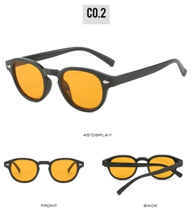 Retro round sunglasses with thick black frames, orange lenses and silver rivets detail