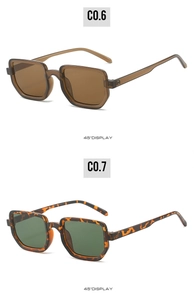 Detail view of square sunglasses in amber brown and tortoiseshell frames at 45 degree angle